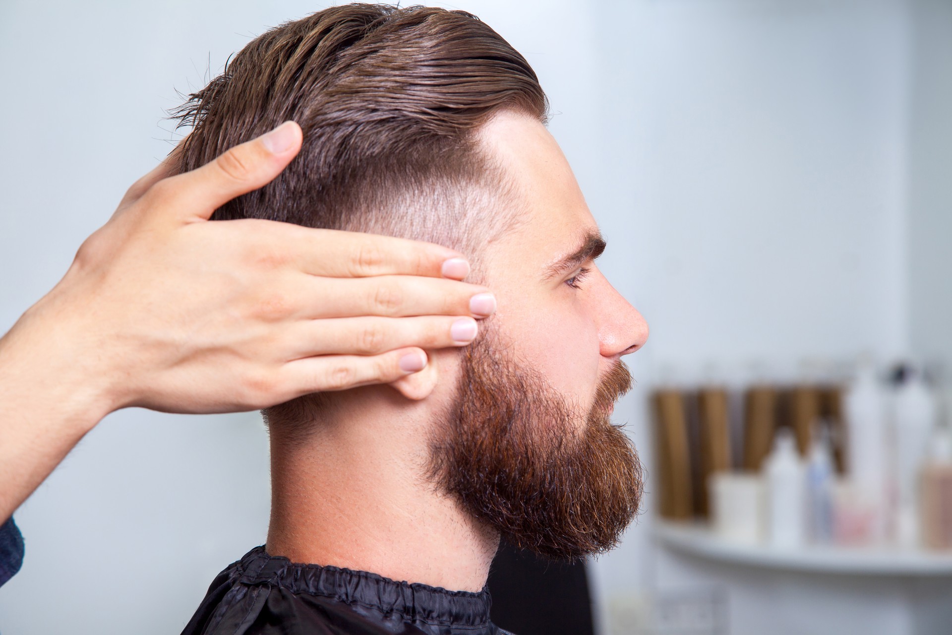 Bearded man sitting in the barbershop